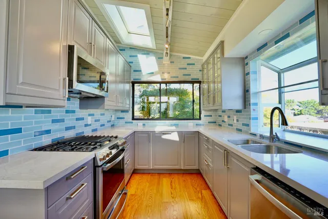 a kitchen with a sink and a stove