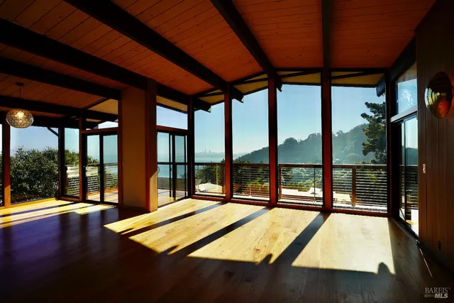 a view of an empty room with a balcony
