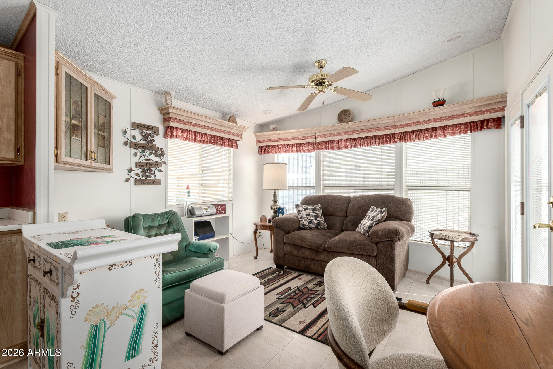 7750 East Broadway Road, Unit 533 Mesa, AZ 85208 - Photo 12 of 21 a living room with furniture and a large window