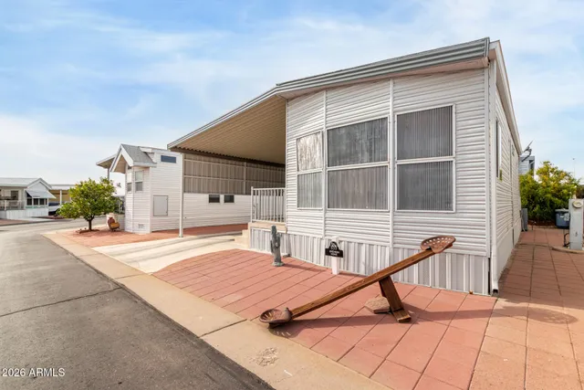a house view with a sitting space and garden space