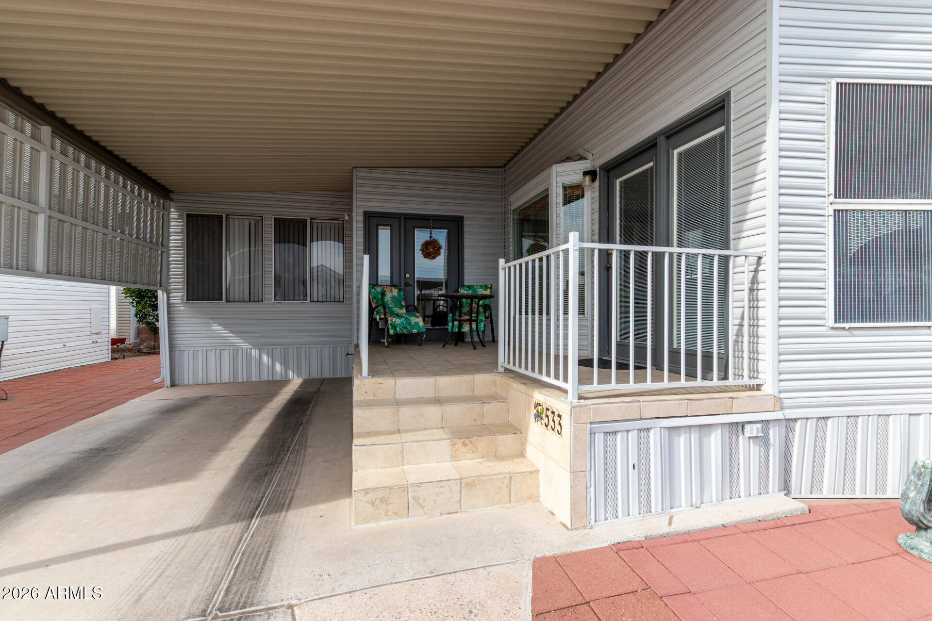 7750 East Broadway Road, Unit 533 Mesa, AZ 85208 - Photo 7 of 21 a view of a house with a wooden fence