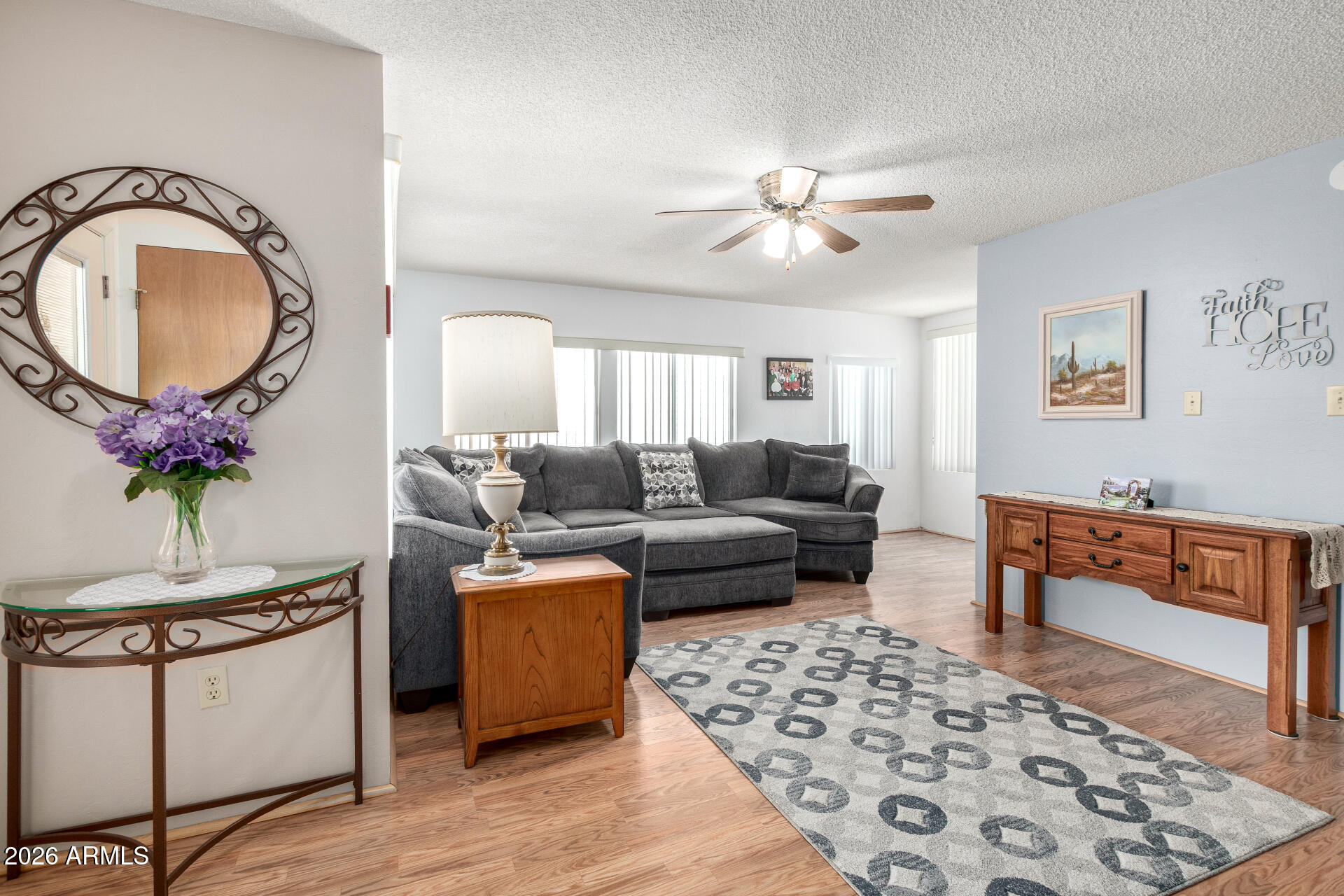 7750 East Broadway Road, Unit 533 Mesa, AZ 85208 - Photo 9 of 21 a living room with furniture and a mirror