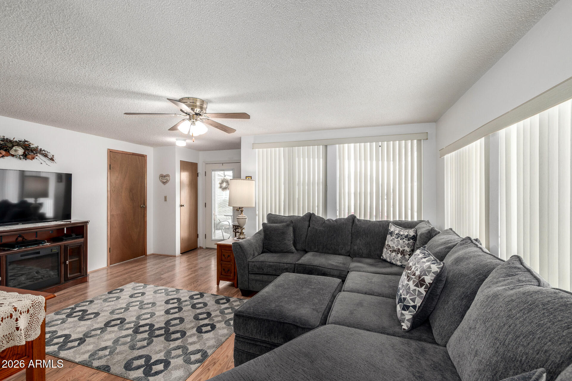 7750 East Broadway Road, Unit 533 Mesa, AZ 85208 - Photo 10 of 21 a living room with furniture and a couch