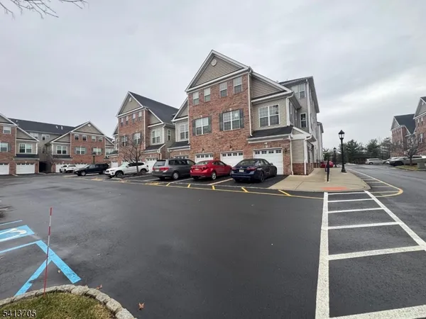 a city street lined with buildings and cars on the road