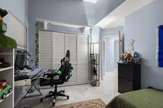 a view of a workspace with furniture and bedroom