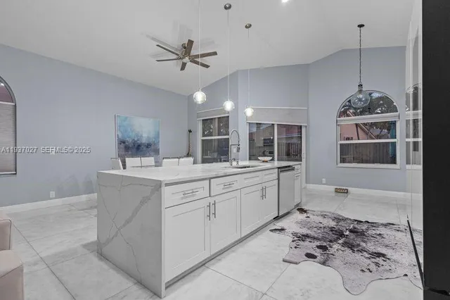 a spacious bathroom with a sink and a mirror