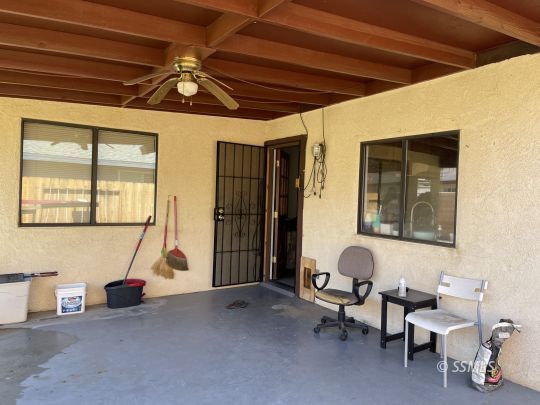 118 Chambers Street Ridgecrest, CA 93555 - Photo 6 of 16 a living room with furniture a air conditioner vent and a window