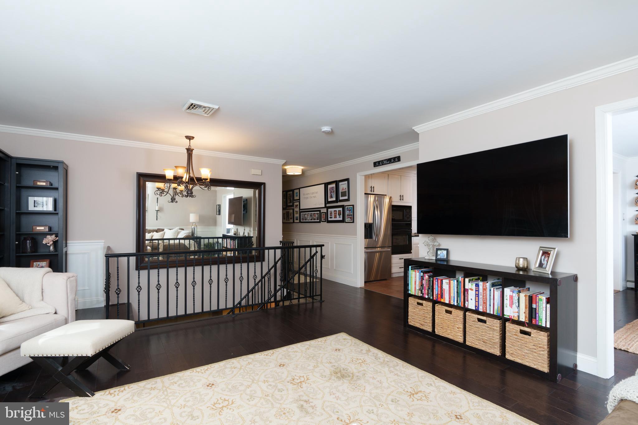 1411 Greenhill Road West Chester, PA 19380 - Photo 11 of 40 a living room with furniture and a flat screen tv