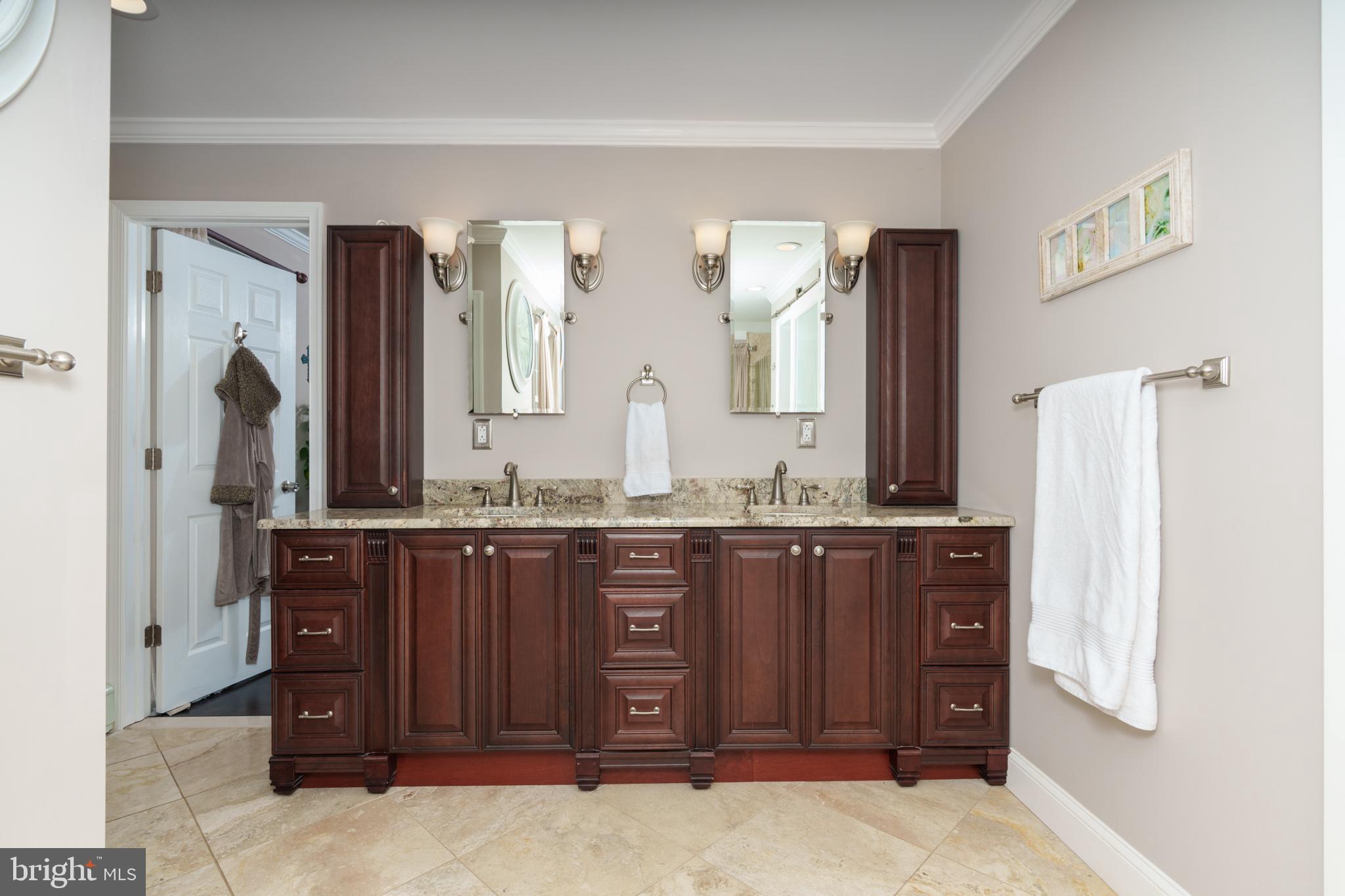 1411 Greenhill Road West Chester, PA 19380 - Photo 23 of 40 a bathroom with a granite countertop sink and a mirror