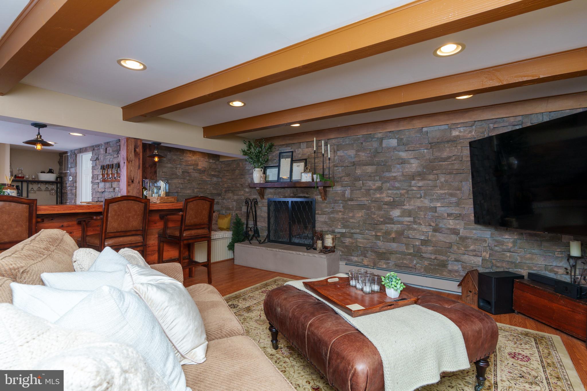 1411 Greenhill Road West Chester, PA 19380 - Photo 29 of 40 a dining room with furniture and a flat screen tv