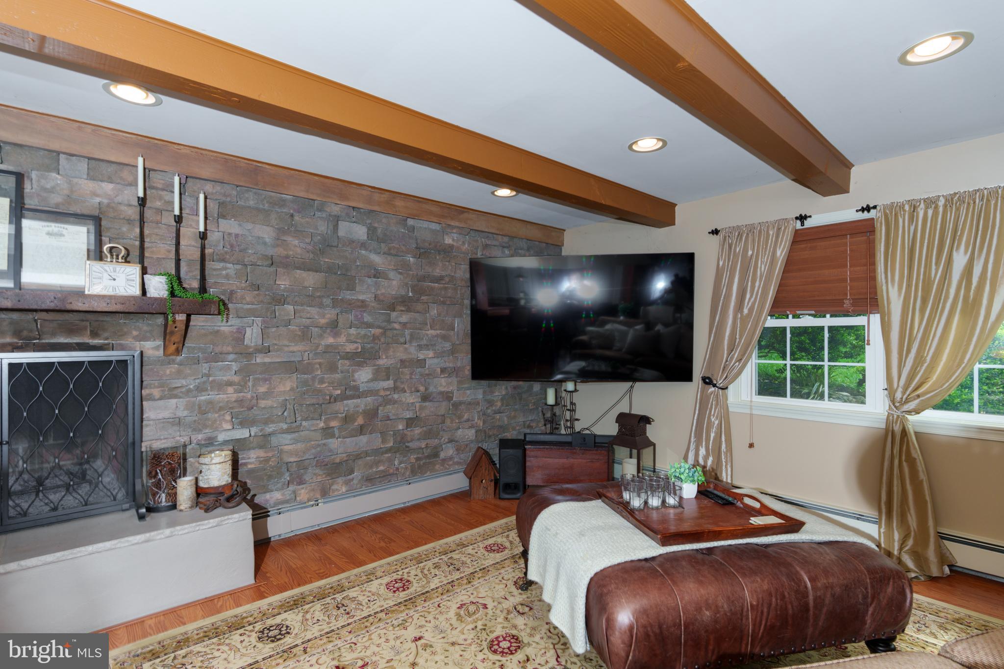 1411 Greenhill Road West Chester, PA 19380 - Photo 31 of 40 a living room with furniture and a flat screen tv