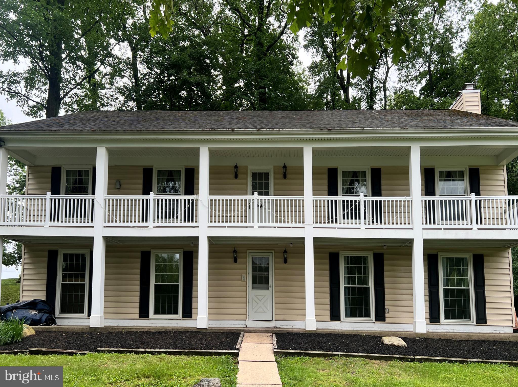 1411 Greenhill Road West Chester, PA 19380 - Photo 36 of 40 a front view of houses with yard
