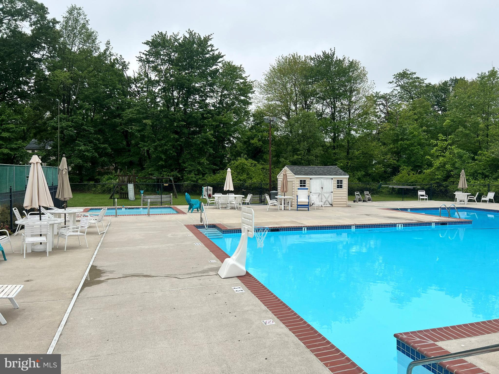 1411 Greenhill Road West Chester, PA 19380 - Photo 40 of 40 a view of a swimming pool with a patio