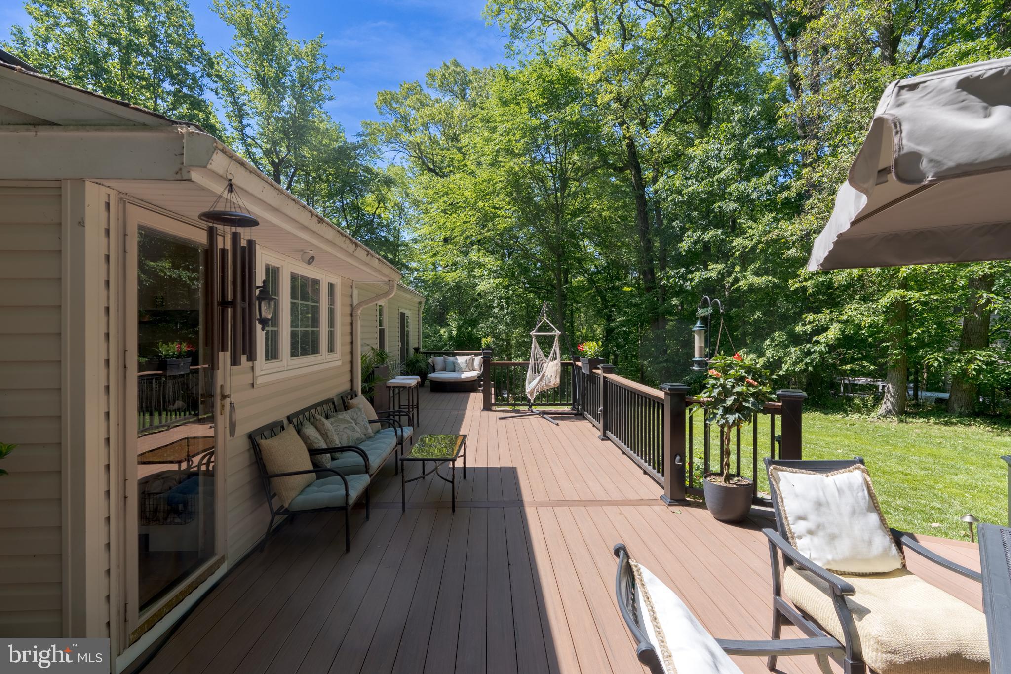 1411 Greenhill Road West Chester, PA 19380 - Photo 5 of 40 a view of a patio with table and chairs with wooden floor and fence