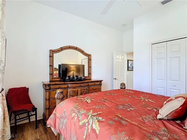 a bedroom with a bed and a chair