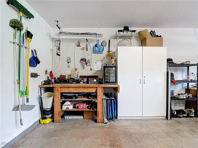 a view of a patio with a table chairs and a backyard