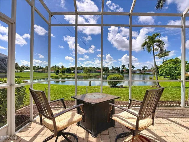 a patio with a yard table and chairs