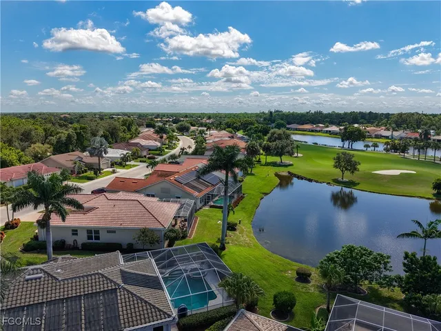 an aerial view of a house with yard swimming pool and outdoor seating