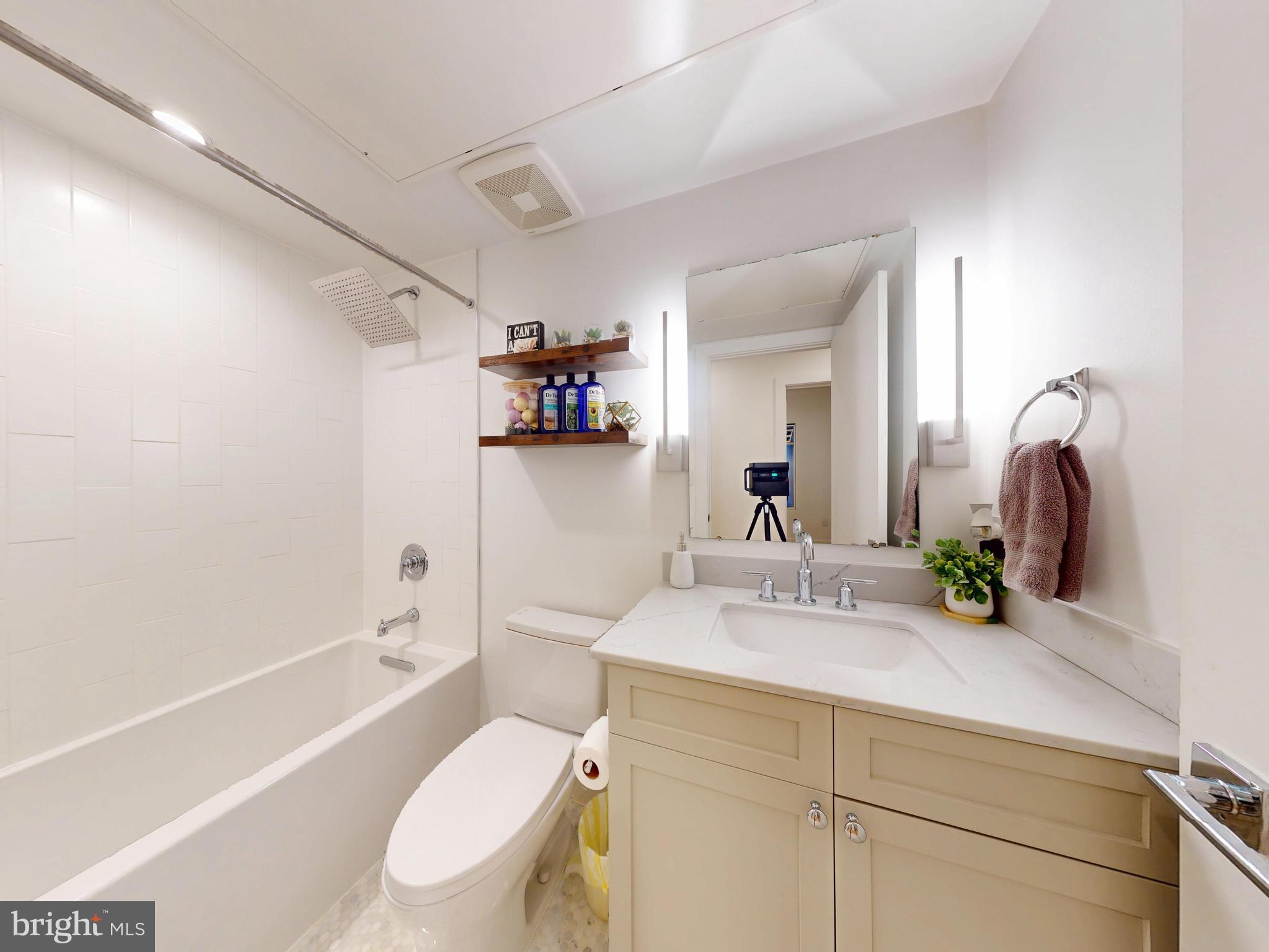 2642 39th Street Northwest, Unit 2 Washington, DC 20007 - Photo 15 of 25 a bathroom with a sink a toilet and shower