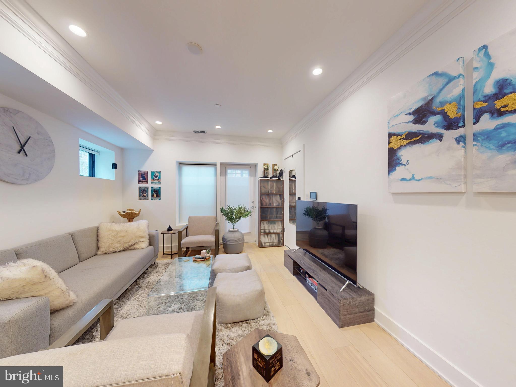 2642 39th Street Northwest, Unit 2 Washington, DC 20007 - Photo 3 of 25 a living room with furniture and a flat screen tv