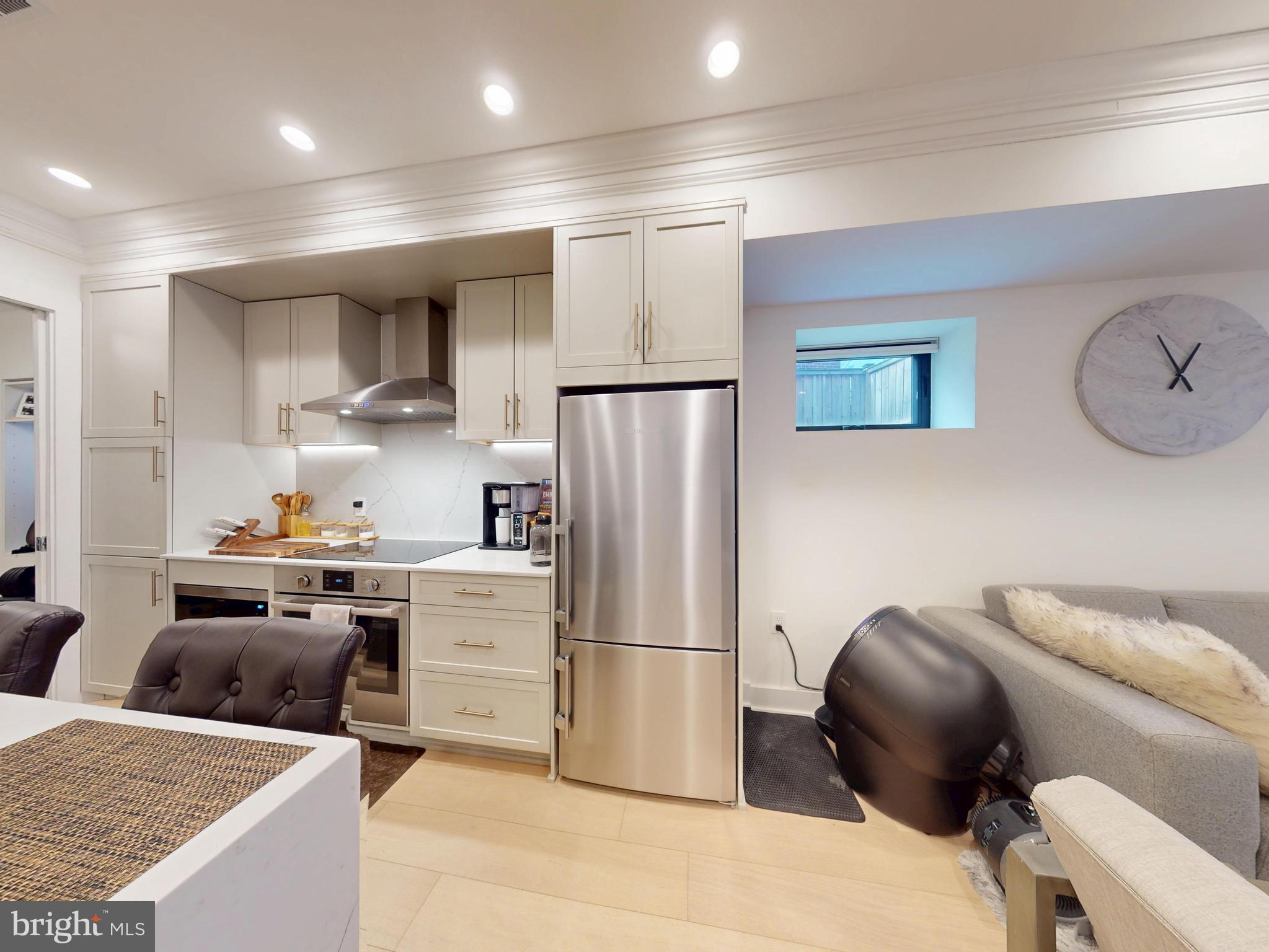 2642 39th Street Northwest, Unit 2 Washington, DC 20007 - Photo 7 of 25 a kitchen with stainless steel appliances granite countertop a refrigerator and a stove top oven
