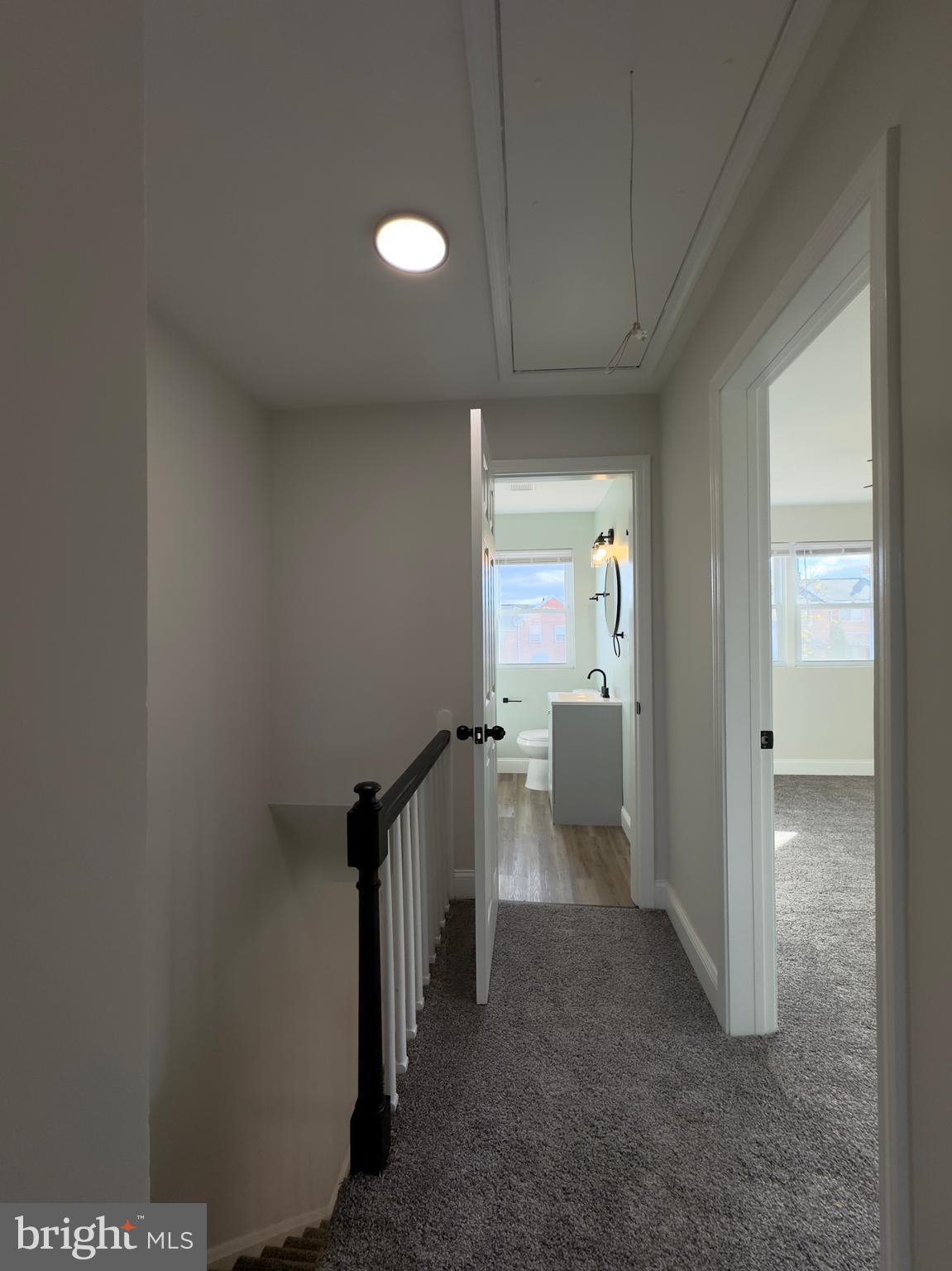 5430 Whitlock Road Baltimore, MD 21229 - Photo 16 of 30 a view of a hallway with toilet and a sink