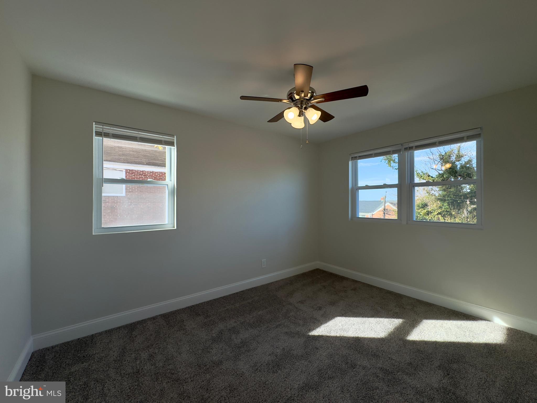 5430 Whitlock Road Baltimore, MD 21229 - Photo 29 of 30 an empty room with windows and fan