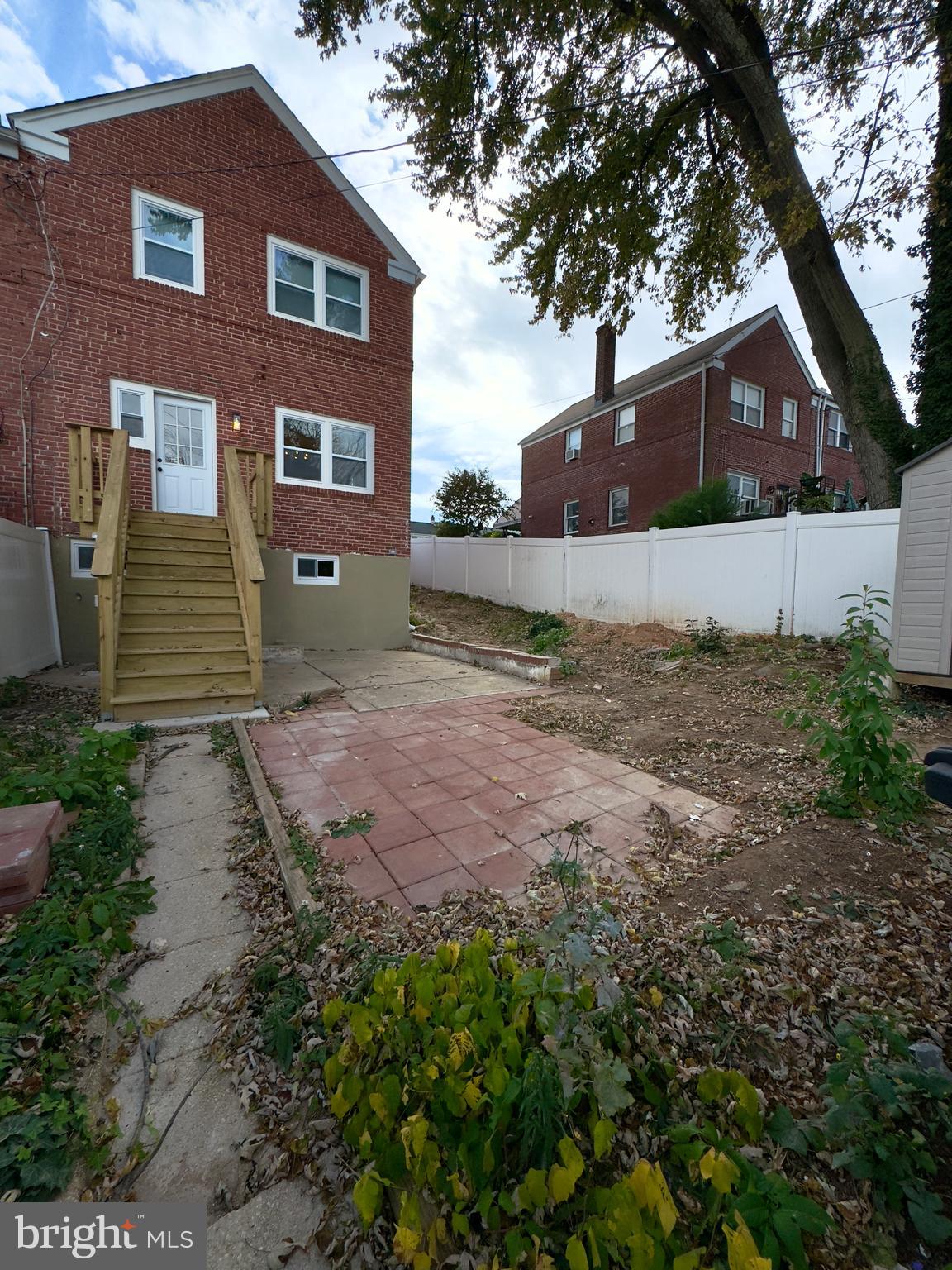 5430 Whitlock Road Baltimore, MD 21229 - Photo 4 of 30 a front view of a house with a yard and garage