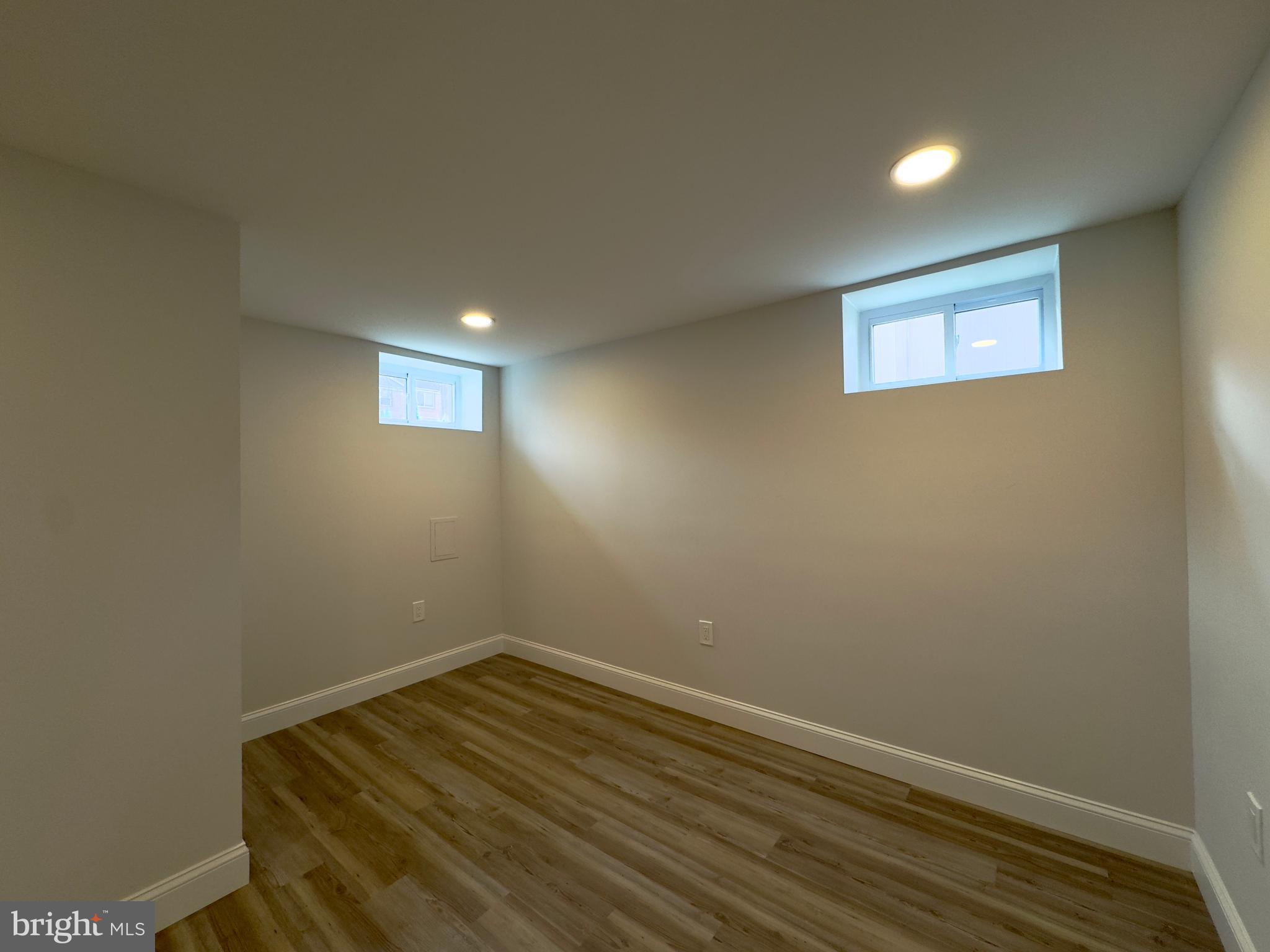 5430 Whitlock Road Baltimore, MD 21229 - Photo 7 of 30 wooden floor in an empty room