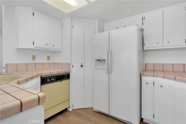 a kitchen with cabinets and a stove