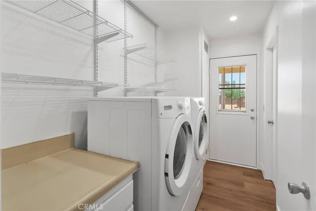 a view of a storage & utility room with washer and dryer
