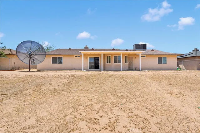 a view of house with yard