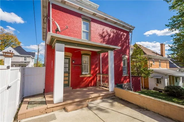 a view of a building with traffic signal lights