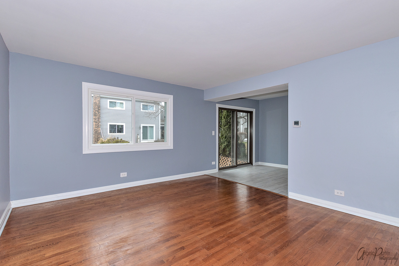 452 Maple Drive Wheeling, IL 60090 - Photo 11 of 30 a view of an empty room with wooden floor and a window