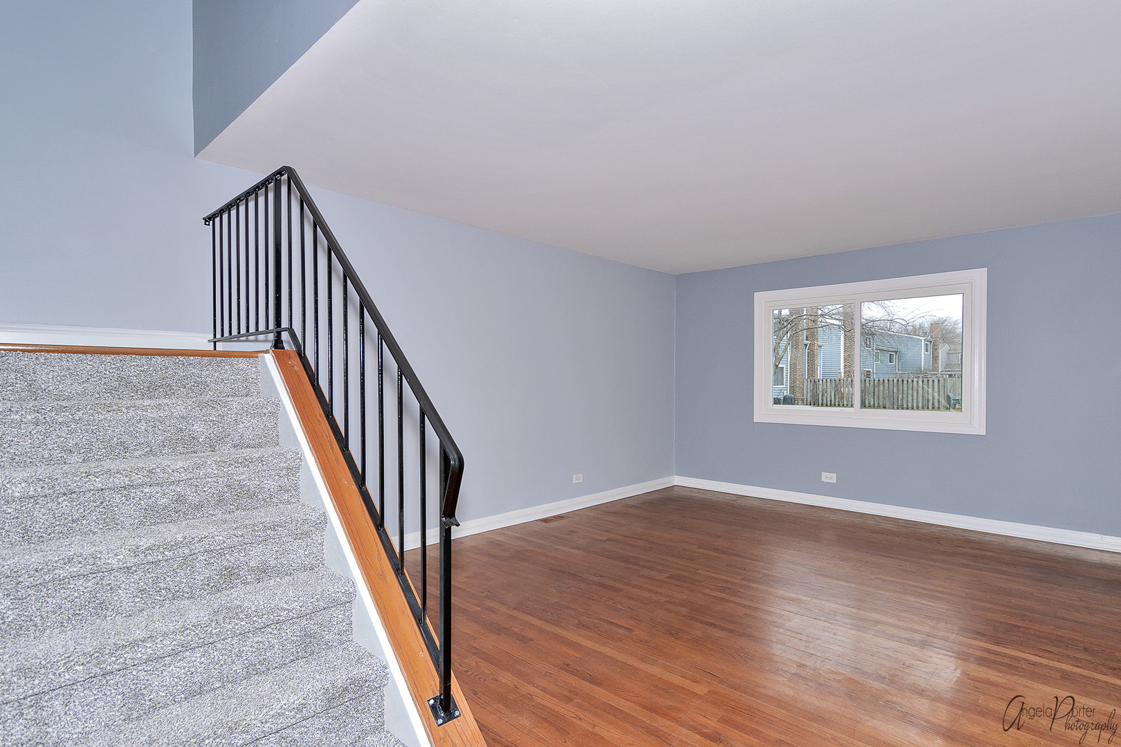 452 Maple Drive Wheeling, IL 60090 - Photo 12 of 30 a view of an empty room with wooden floor and a window