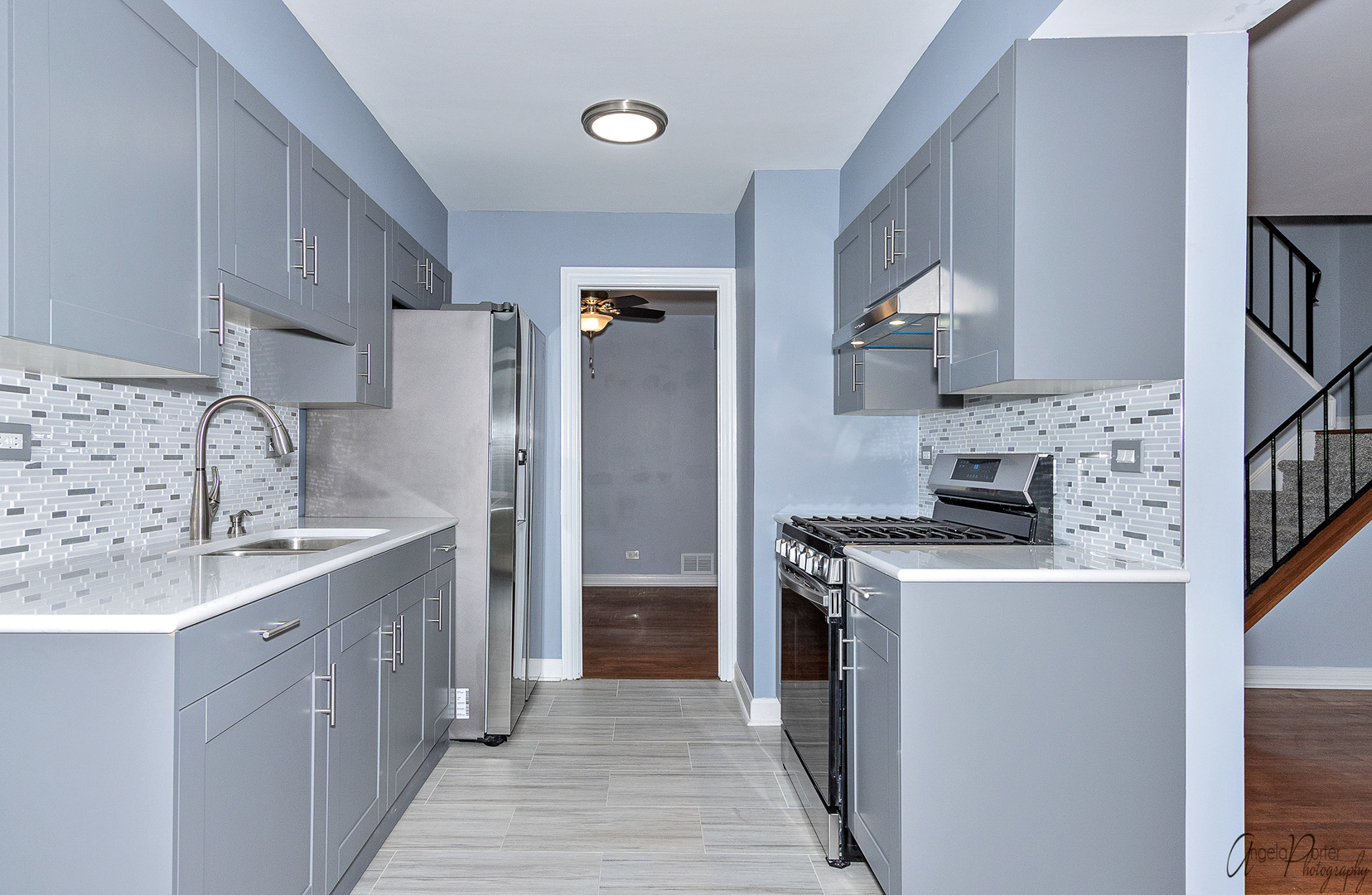 452 Maple Drive Wheeling, IL 60090 - Photo 8 of 30 a kitchen with a stove top oven sink and refrigerator