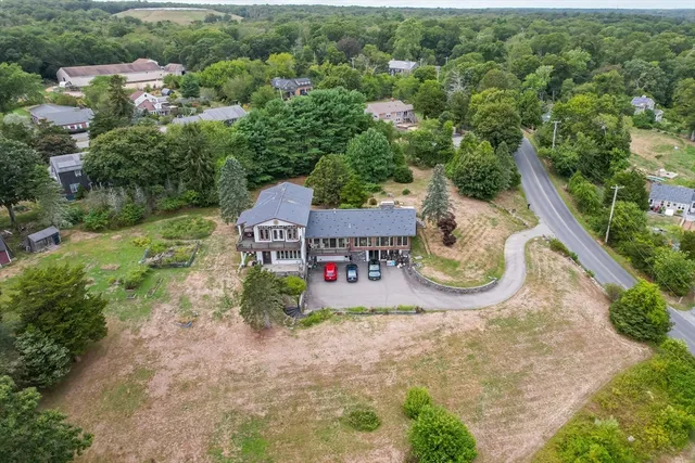 an aerial view of a house with outdoor space