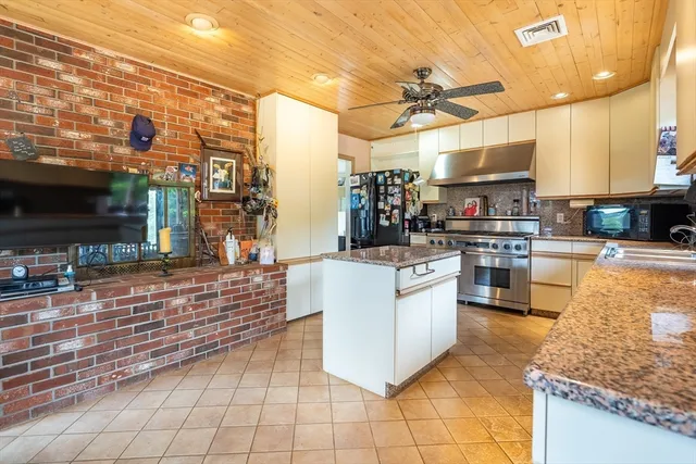 a spacious bathroom with a double vanity sink and a mirror