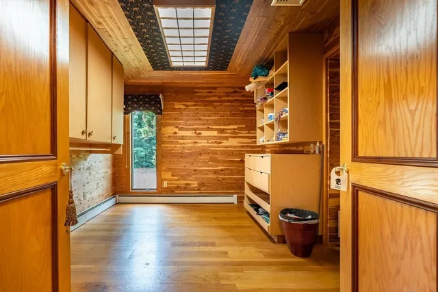 a living room with furniture and large windows