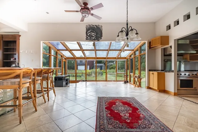 a bathroom with a toilet and a mirror