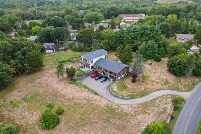 an aerial view of a house with outdoor space
