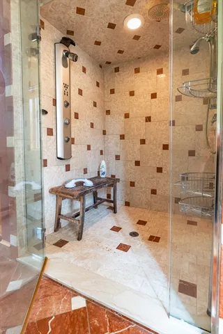 a front view of a house with a garden and swimming pool