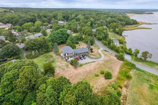 an aerial view of a house with yard swimming pool and outdoor seating