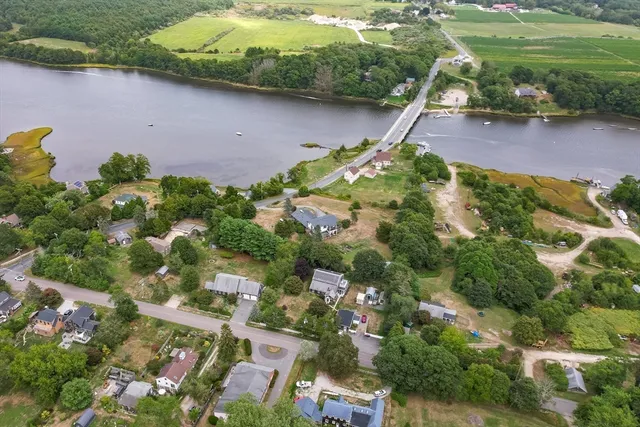 an aerial view of residential house with outdoor space and lake view