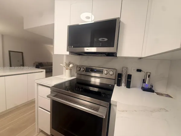 a kitchen with a stove and a microwave