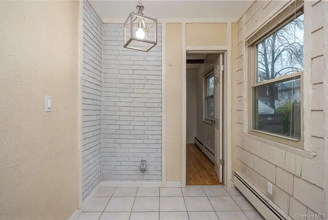 a view of an empty room with a bathroom