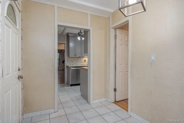 a view of a hallway with a dining area