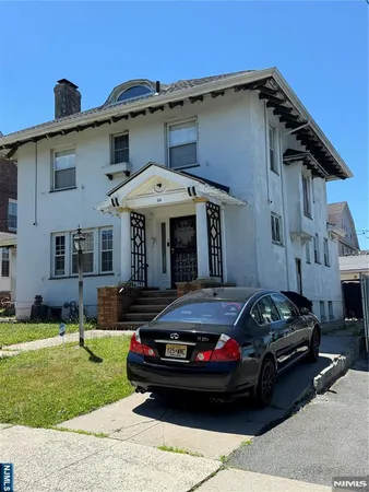 a car parked in front of a house