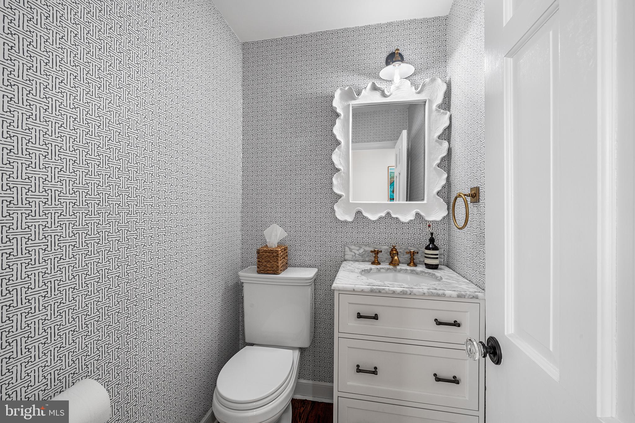 48 Northwoods Road Wayne, PA 19087 - Photo 15 of 31 a bathroom with a sink vanity mirror and toilet