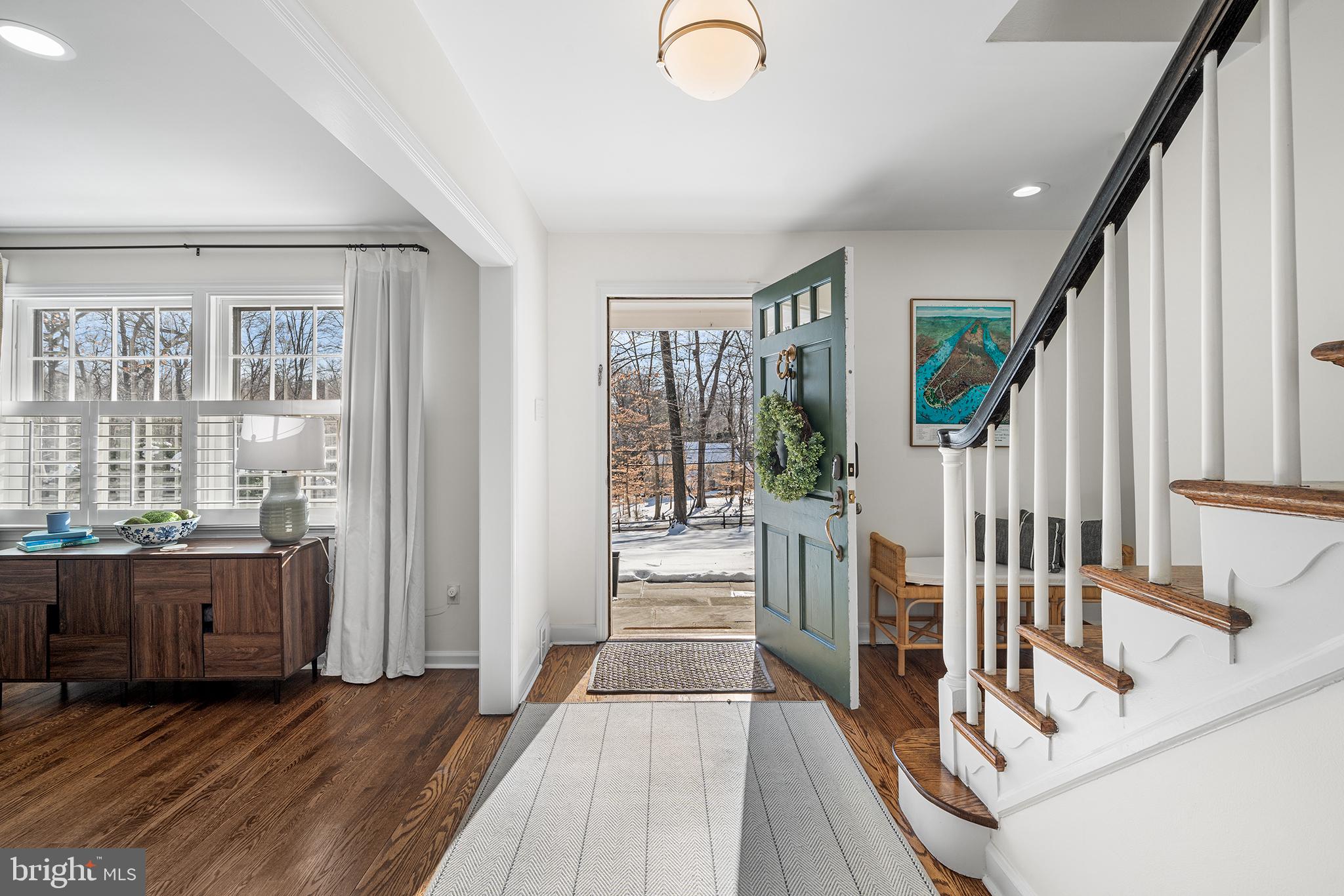48 Northwoods Road Wayne, PA 19087 - Photo 4 of 31 a view of a hallway with wooden floor and windows